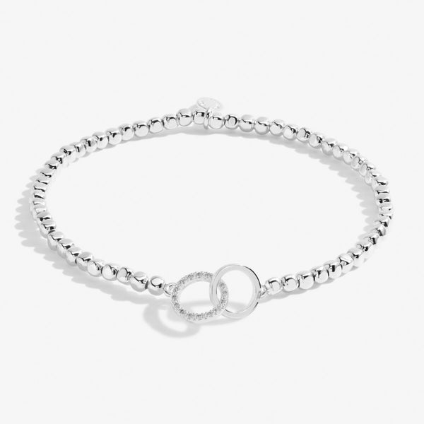 Silver stretch bracelet with circle shaped charm