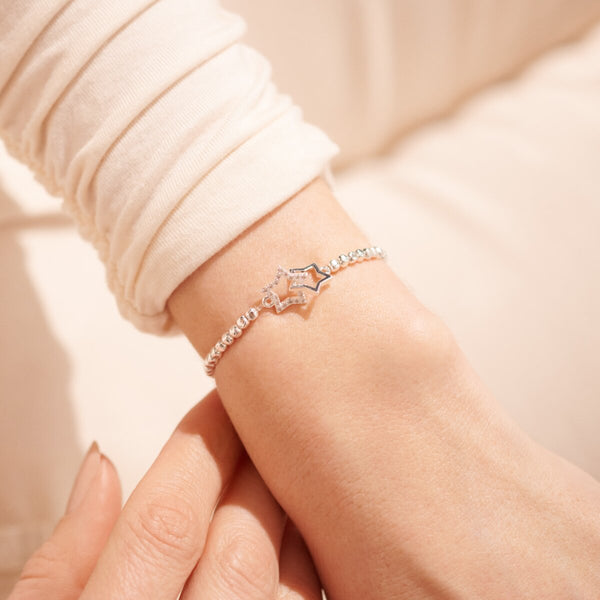 Silver stretch bracelet with star shaped charm