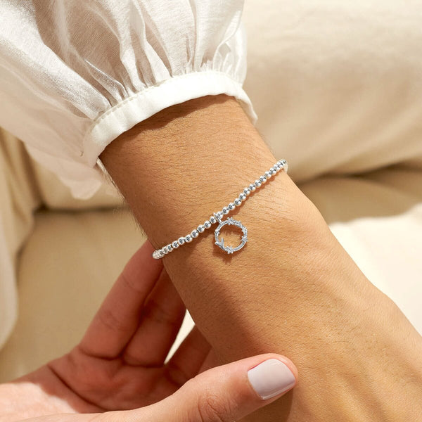 Silver plated beaded stretch bracelet with hoop charm
