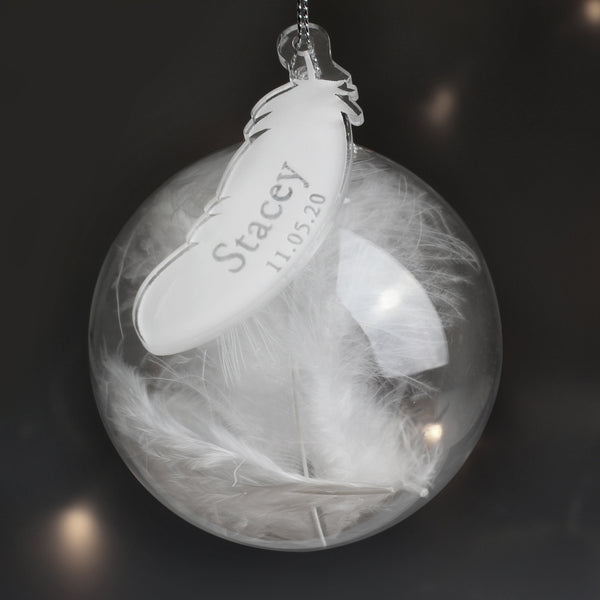 Glass bauble with feather tag