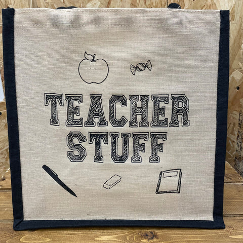 This premium quality jute shopping bag with a short handle featuring fun printed teacher related artwork with wording 'Teacher Stuff.'  Colour:  Natural with black print   Dimensions: 40cm x 30cm x 19cm