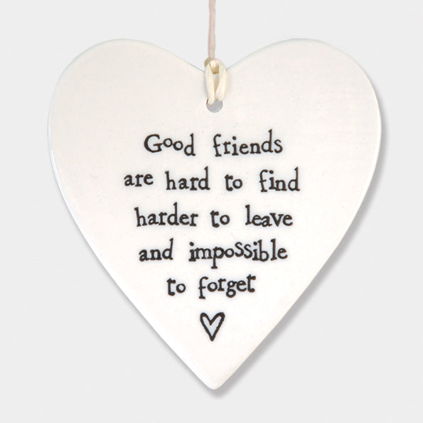 East of India hanging porcelain heart which reads:  'Good friends are hard to find, harder to leave and impossible to forget'