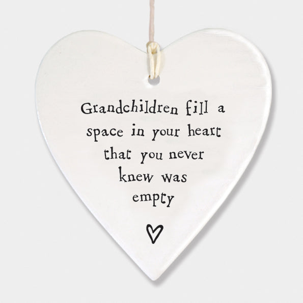 East of India hanging porcelain heart which reads:  'Grandchildren fill a space in your heart that you never knew was empty'