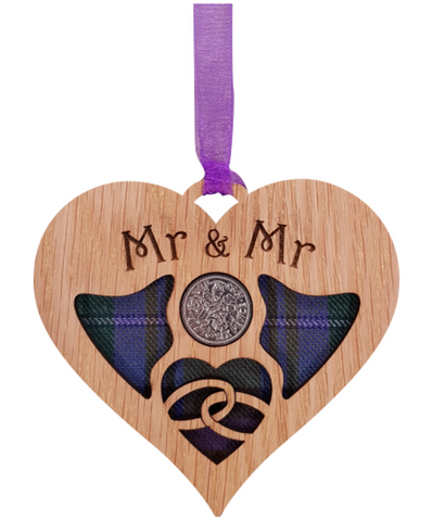 A unique keepsake gift with a Scottish twist.  The sixpence is mounted onto hanging oak veneered wooden heart with tartan inserts, mounted on card and packaged in clear cellophane packets.  The sentiment 'Mr & Mr' is engraved across the heart.