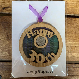 A unique keepsake gift with a Scottish twist.  The sixpence is mounted onto a round hanging oak veneered wood with tartan inserts, mounted on card and packaged in clear cellophane packets.  'Happy 30th' is cut into the wooden hanging.