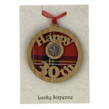 A unique keepsake gift with a Scottish twist.  The sixpence is mounted onto a round hanging oak veneered wood with tartan inserts, mounted on card and packaged in clear cellophane packets.  'Happy 30th' is cut into the wooden hanging.