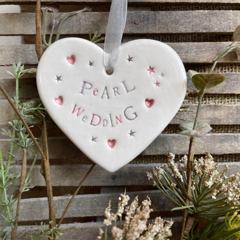 White ceramic hanging heart saying Pearl Wedding