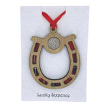 Wooden cut out horseshoe with tartan insert and lucky sixpence with ribbon for hanging.