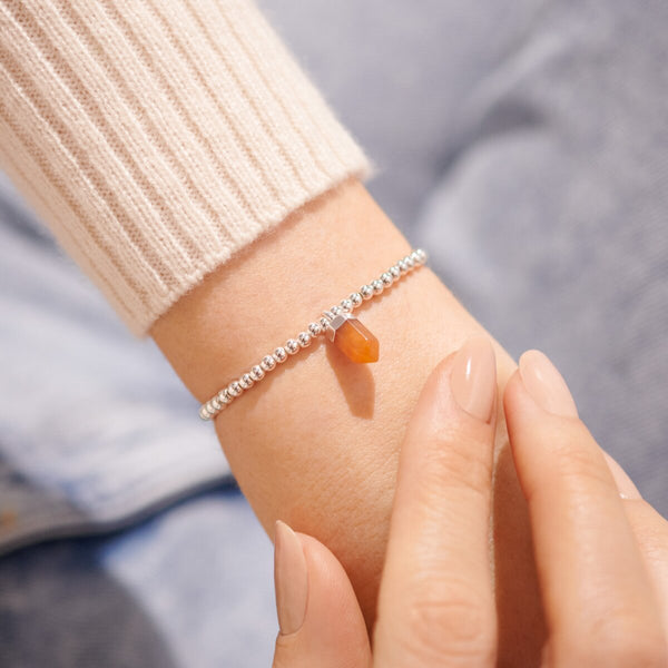 Silver beaded bracelet with amber charm