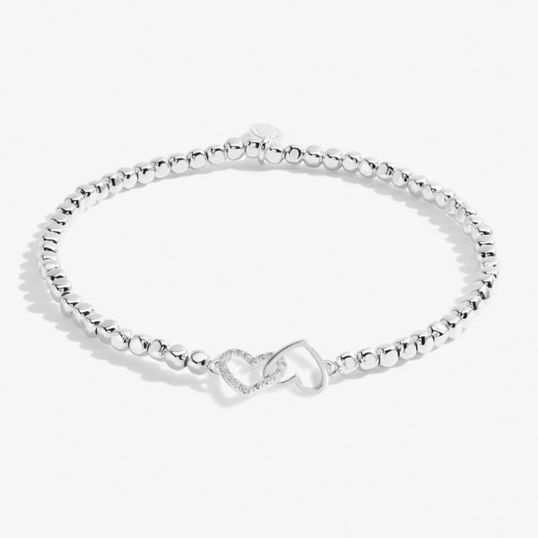 Silver beaded bracelet with heart charm