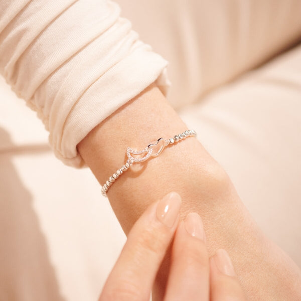 Silver stretch bracelet with moon and heart charm