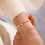 Silver beaded bracelet with heart charm