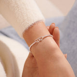 Silver beaded bracelet with heart charm