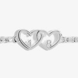 Silver beaded bracelet with heart charm