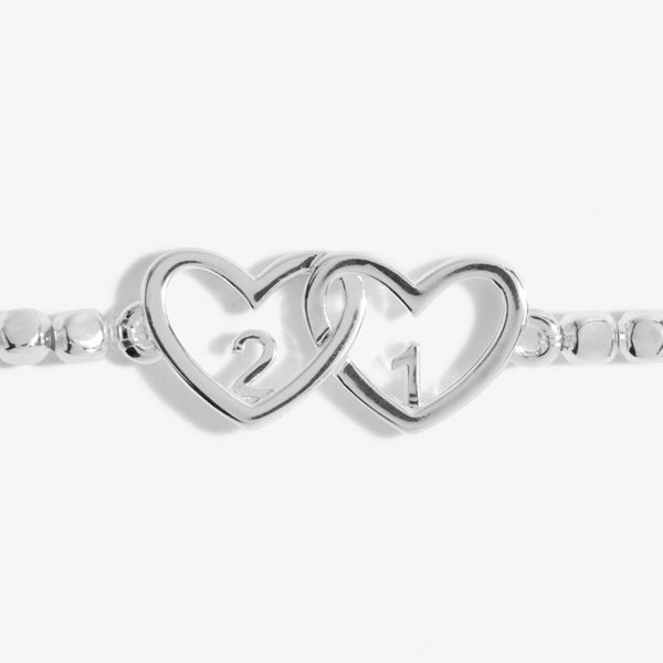 Silver beaded bracelet with heart charm