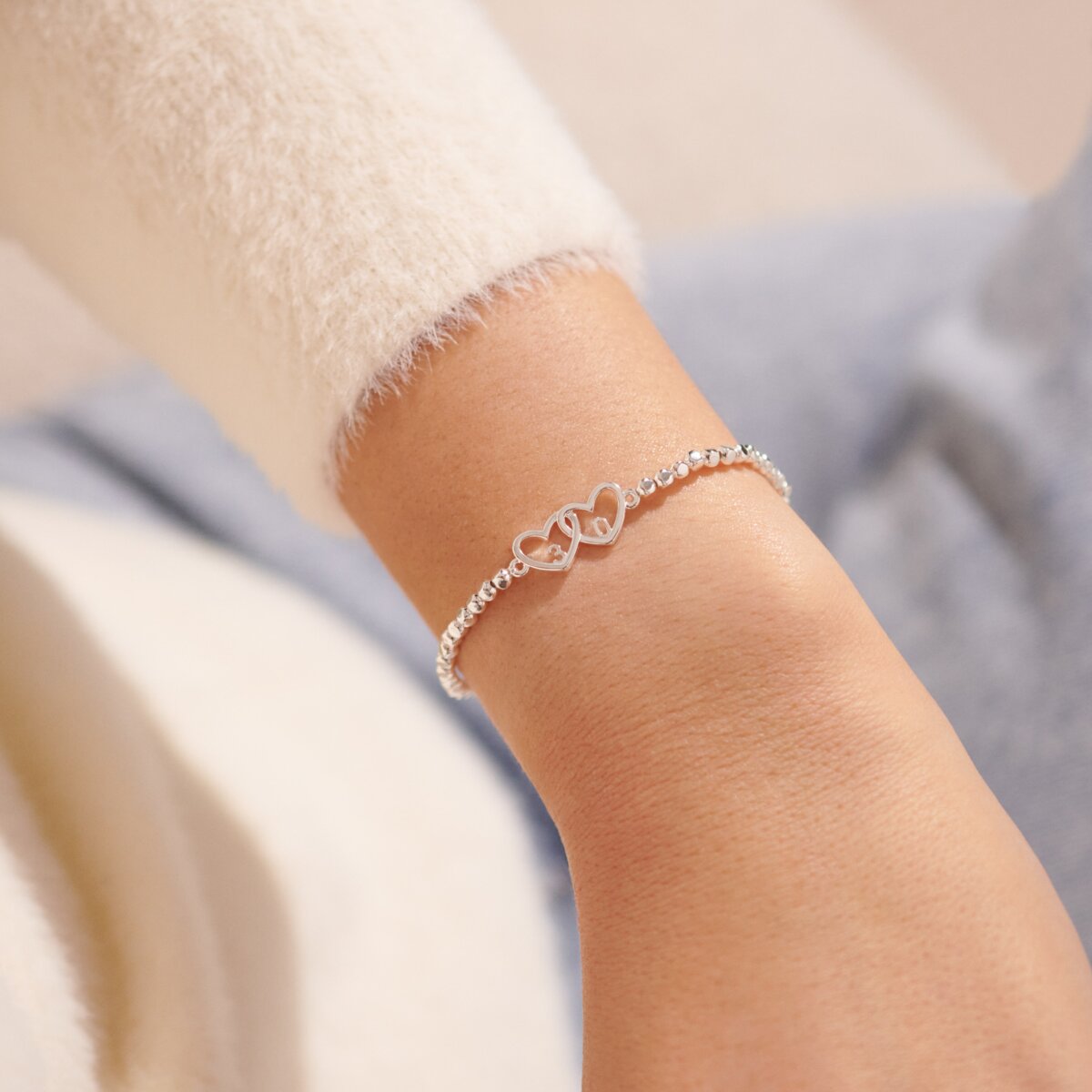 Silver beaded bracelet with heart charm
