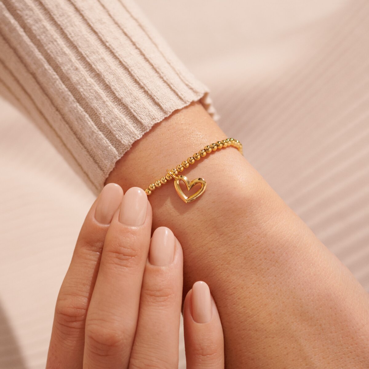 Gold plated Joma jewellery bracelet with hanging heart charm