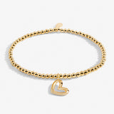 Gold plated Joma jewellery bracelet with hanging heart charm