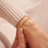 Gold plated Joma jewellery bracelet with hanging feather charm