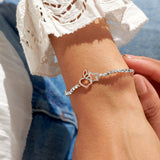 Silver plated beaded stretch bracelet with apple and star charm