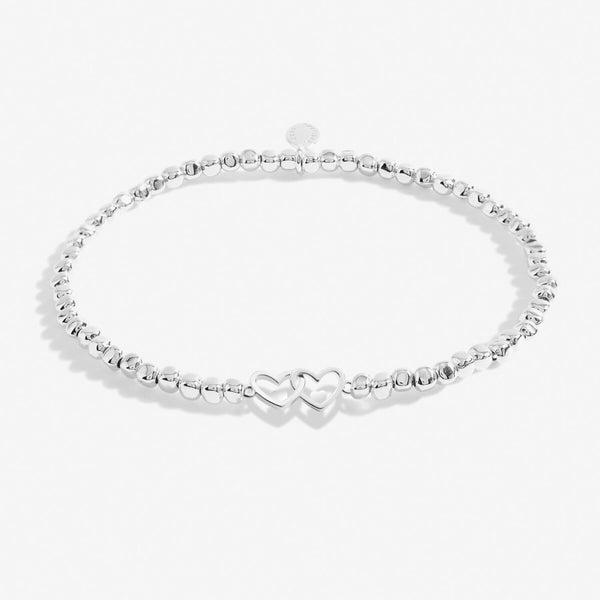 Silver plated beaded stretch bracelet with heart charm
