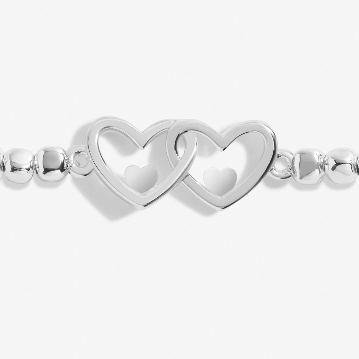 Silver plated beaded stretch bracelet with heart charm