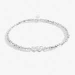Silver plated beaded stretch bracelet with heart charm