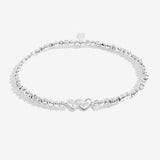 Silver plated beaded stretch bracelet with heart charm