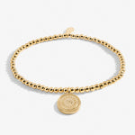 Gold plated beaded bracelet with charm
