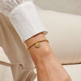 Gold plated beaded bracelet with charm