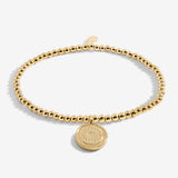 Gold plated beaded bracelet with charm