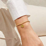 Gold plated beaded bracelet with charm