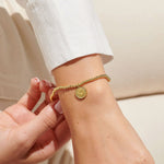 Gold plated beaded bracelet with charm