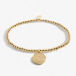 Gold plated beaded bracelet with charm