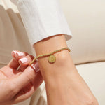 Gold plated beaded bracelet with charm