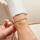 Gold plated beaded bracelet with charm
