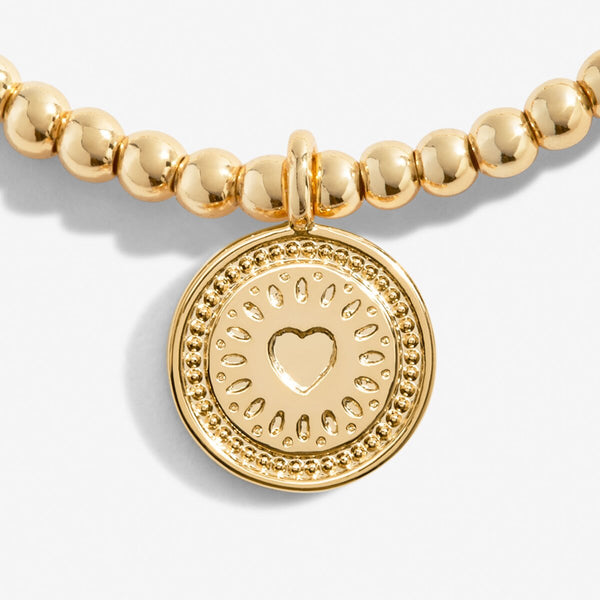 Gold plated beaded bracelet with charm