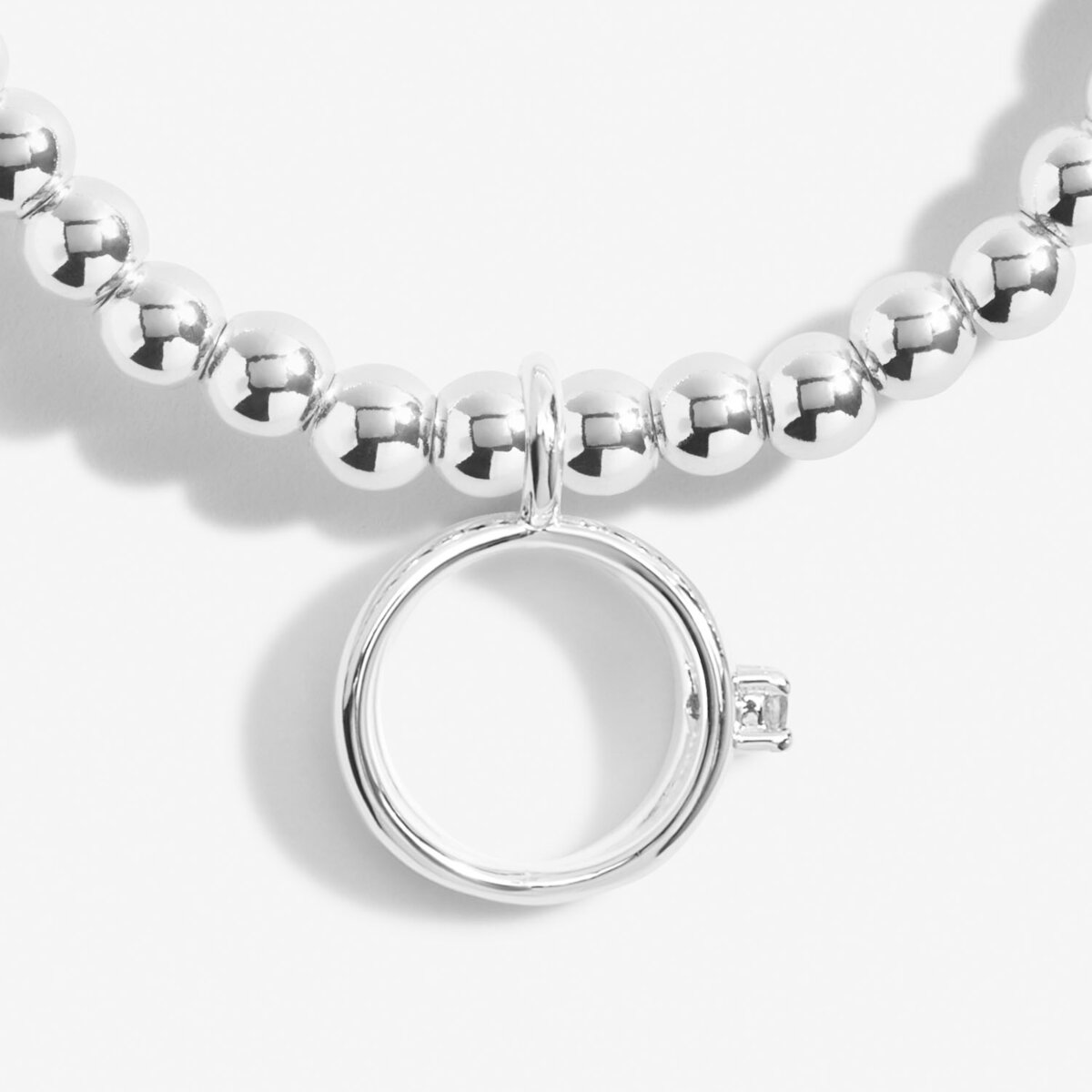 Silver plated beaded stretch bracelet with ring charm