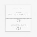 Silver plated beaded stretch bracelet with ring charm