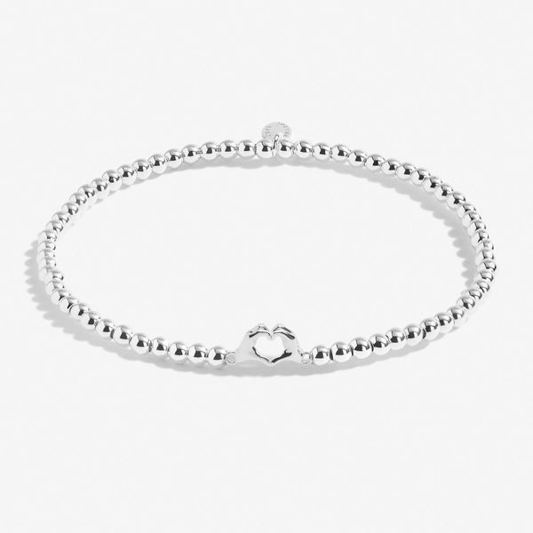 Silver plated beaded stretch bracelet with heart in hands charm
