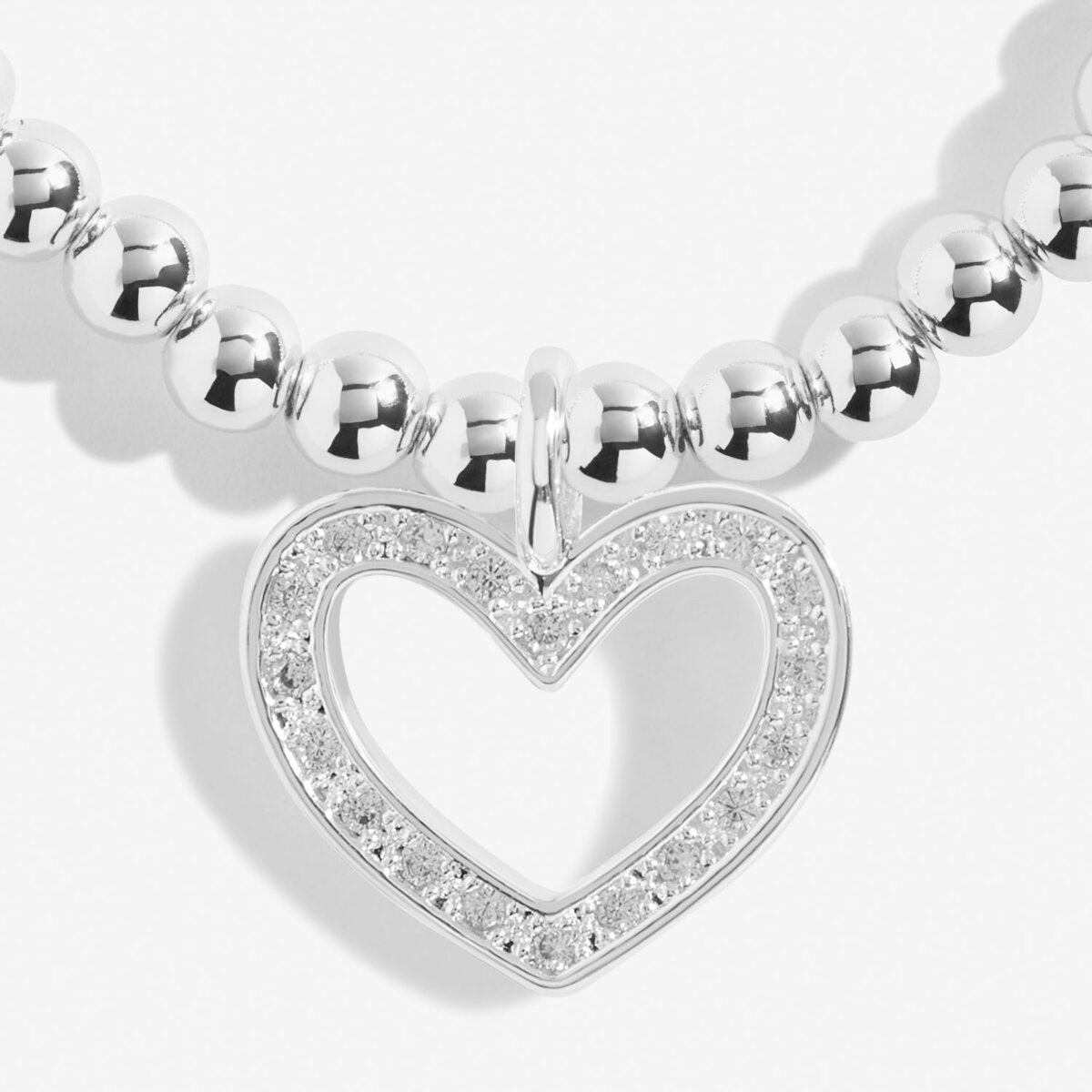 Silver plated beaded stretch bracelet with heart charm