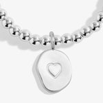 Joma beaded stretch bracelet with hanging charm
