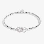 Joma beaded bracelet with interlocked heart charm