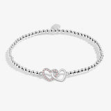Joma beaded bracelet with interlocked heart charm