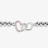 Joma beaded bracelet with interlocked heart charm