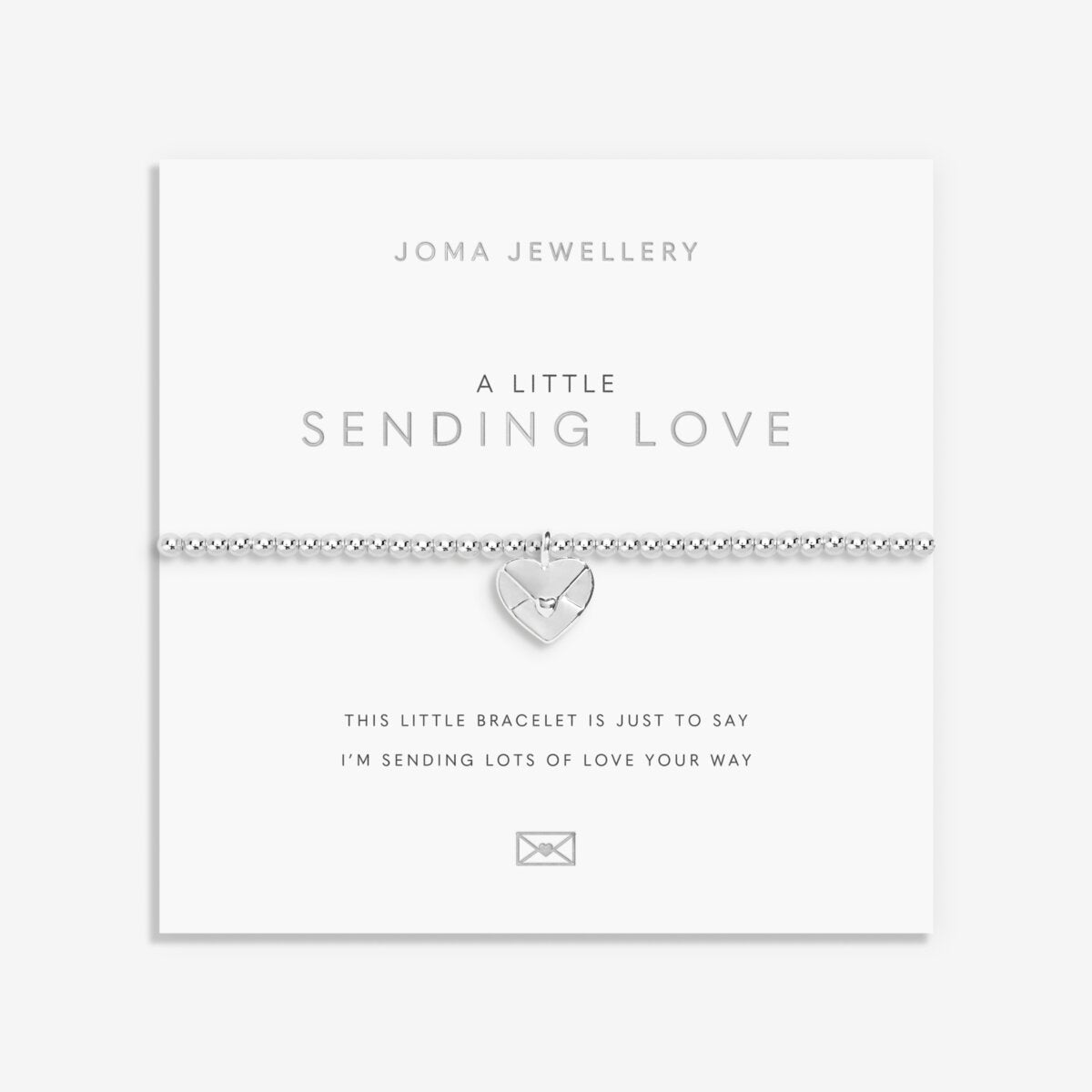 Silver plated 'Sending Love' stretch beaded Joma jewellery bracelet with hanging heart envelope charm on foil stamped sentiment card.