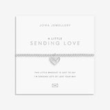 Silver plated 'Sending Love' stretch beaded Joma jewellery bracelet with hanging heart envelope charm on foil stamped sentiment card.