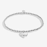 Silver plated 'Sending Love' stretch beaded Joma jewellery bracelet with hanging heart envelope charm on foil stamped sentiment card.