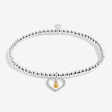 Joma Jewellery bracelet with open sparkling heart charm with hanging gold star on a white foil stamped sentiment card.