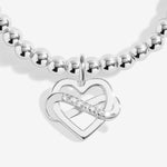 Joma jewellery stretch beaded bracelet with hanging heart infinity charm presented on a foil stamped sentiment card.